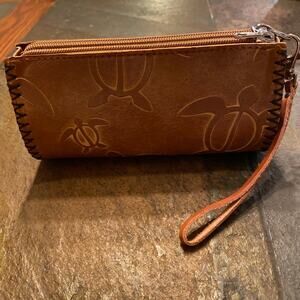 Leather Wristlet with sea turtle engraving.